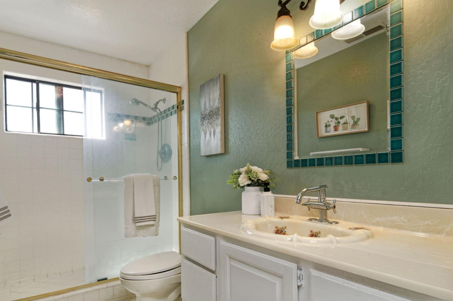 7790 Lost View Road San Jose, CA 95120 - Photo 38 of 48 a bathroom with a sink mirror vanity and toilet