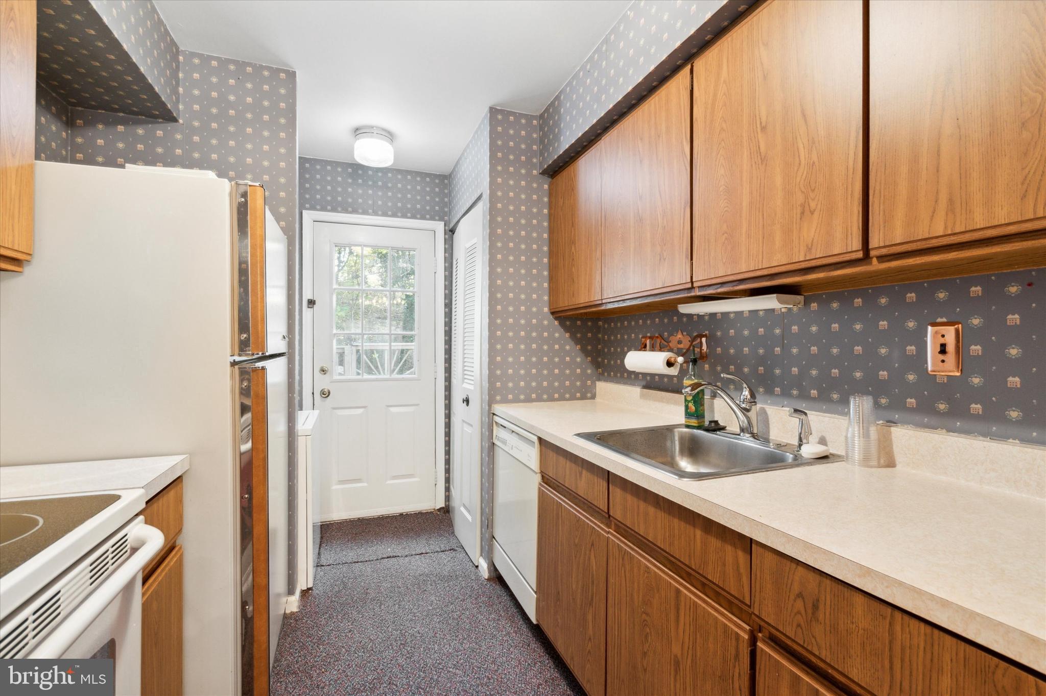 315 Ripka Street, Unit K Philadelphia, PA 19128 - Photo 8 of 15 Kitchen with Rear Exterior Door