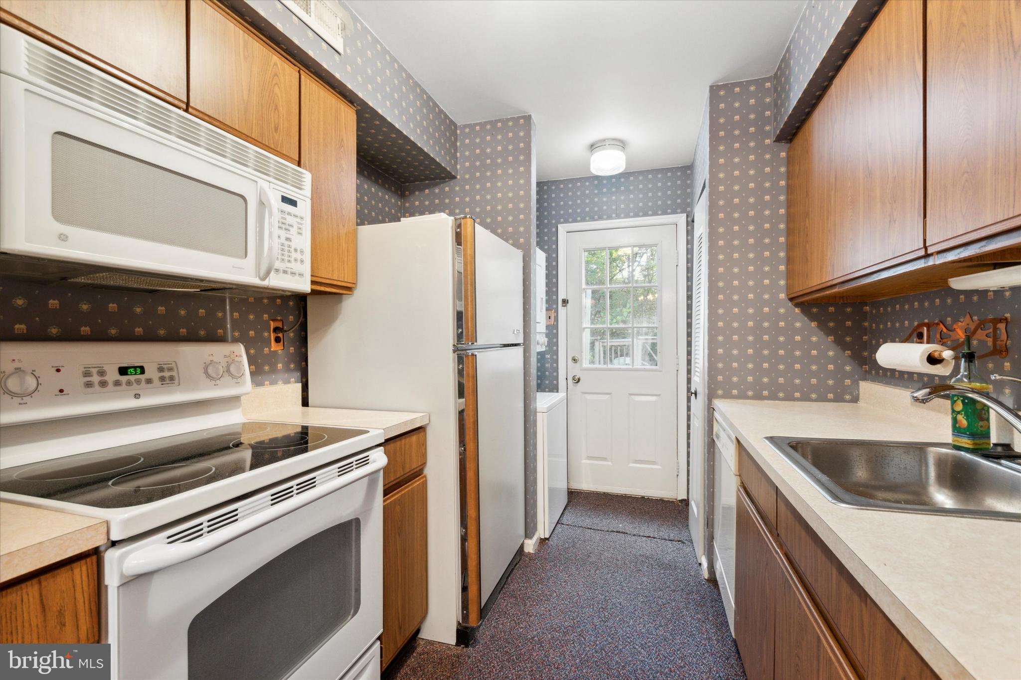 315 Ripka Street, Unit K Philadelphia, PA 19128 - Photo 9 of 15 Kitchen with Rear Exterior Door