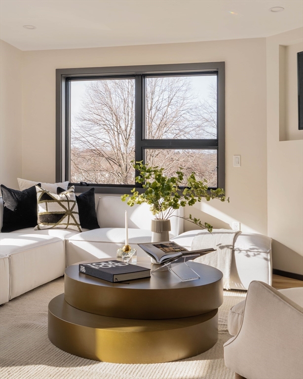 29-31 Highland Road, Unit 29 Brookline, MA 02445 - Photo 11 of 39 a living room with large window