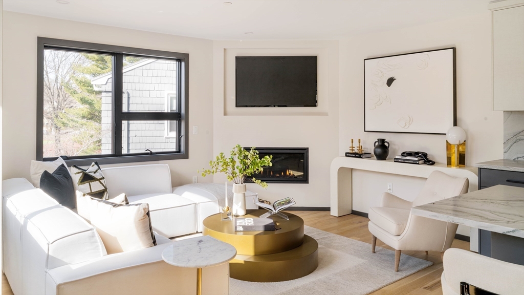 29-31 Highland Road, Unit 29 Brookline, MA 02445 - Photo 12 of 39 a living room with furniture and a flat screen tv