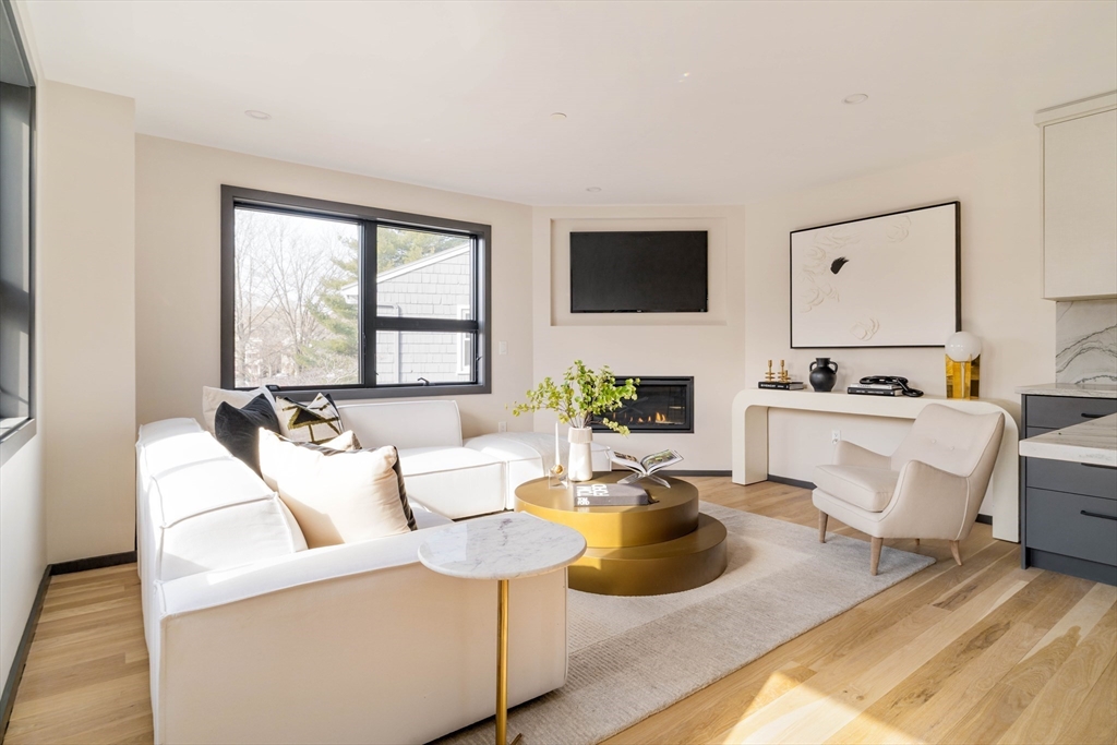 29-31 Highland Road, Unit 29 Brookline, MA 02445 - Photo 14 of 39 a living room with furniture and a flat screen tv