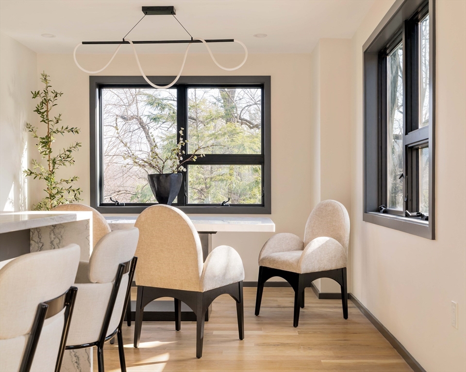 29-31 Highland Road, Unit 29 Brookline, MA 02445 - Photo 18 of 39 a dining room with furniture and window