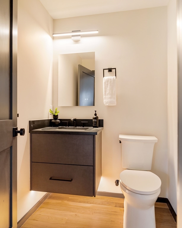 29-31 Highland Road, Unit 29 Brookline, MA 02445 - Photo 20 of 39 a bathroom with a toilet and a mirror