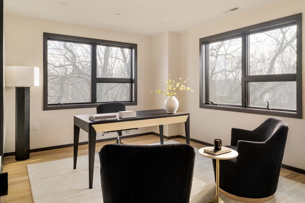 29-31 Highland Road, Unit 29 Brookline, MA 02445 - Photo 25 of 39 a living room with furniture and a window