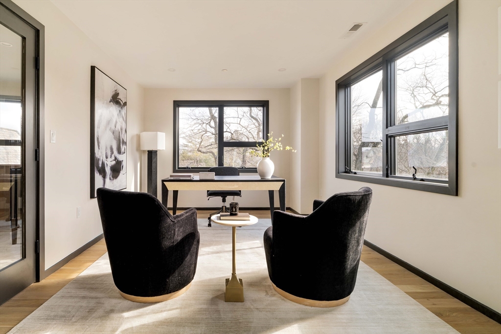 29-31 Highland Road, Unit 29 Brookline, MA 02445 - Photo 26 of 39 a living room with furniture and large windows