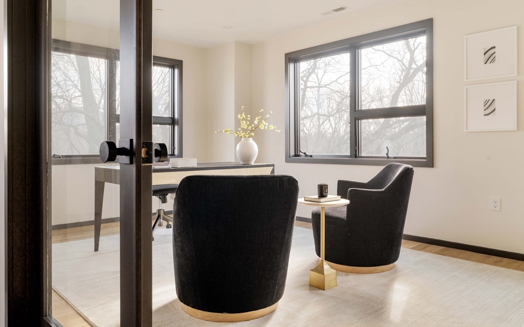 29-31 Highland Road, Unit 29 Brookline, MA 02445 - Photo 27 of 39 a dining room with furniture and windows