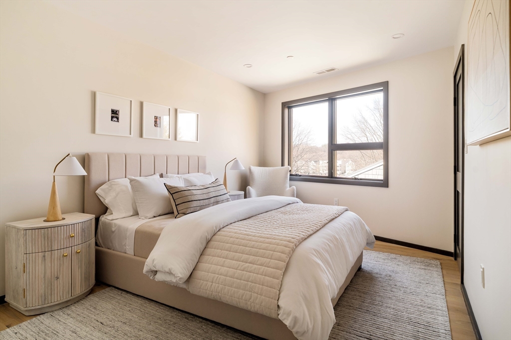 29-31 Highland Road, Unit 29 Brookline, MA 02445 - Photo 28 of 39 a bedroom with double bed and a window