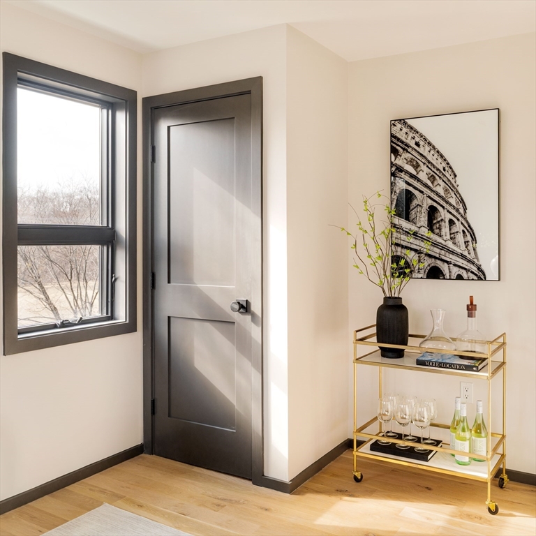 29-31 Highland Road, Unit 29 Brookline, MA 02445 - Photo 34 of 39 a bathroom with a sink and a mirror
