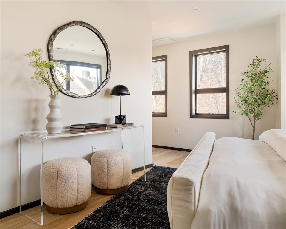 29-31 Highland Road, Unit 29 Brookline, MA 02445 - Photo 36 of 39 a bedroom with bed and a large windows