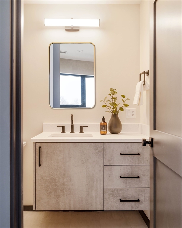 29-31 Highland Road, Unit 29 Brookline, MA 02445 - Photo 38 of 39 a bathroom with a sink vanity and mirror