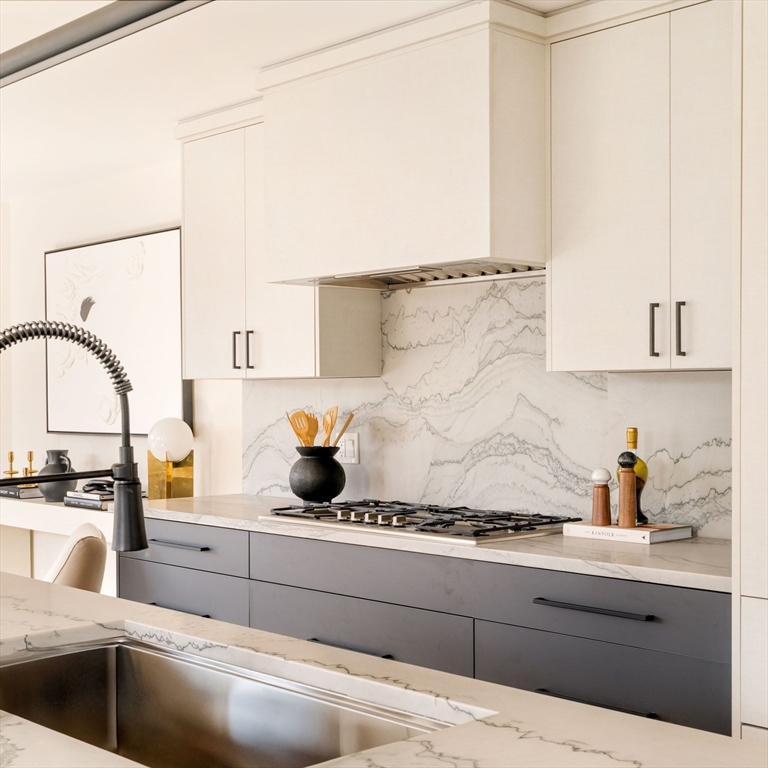 29-31 Highland Road, Unit 29 Brookline, MA 02445 - Photo 5 of 39 a kitchen with a sink a stove and cabinets