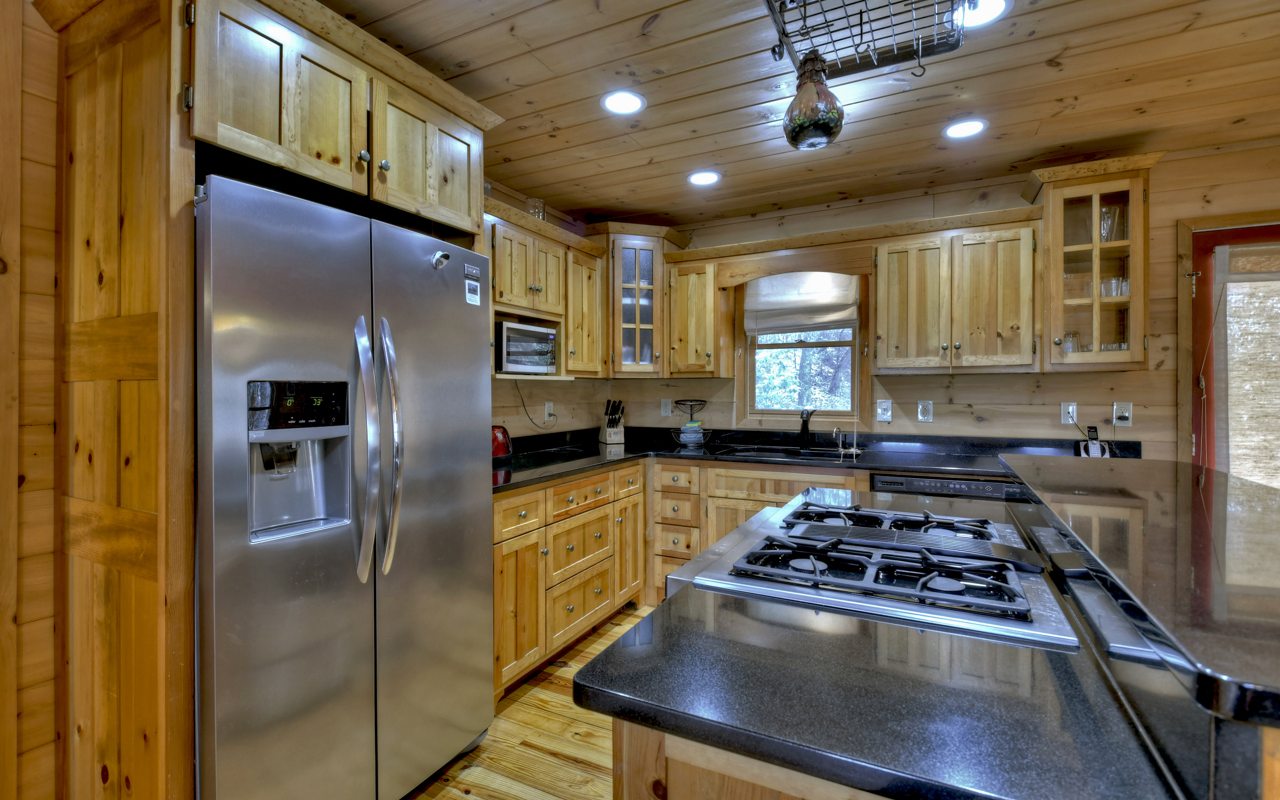 264 Sawmill Circle Blue Ridge, GA 30513 - Photo 16 of 39 a kitchen with stainless steel appliances granite countertop a refrigerator a sink dishwasher a stove and a refrigerator