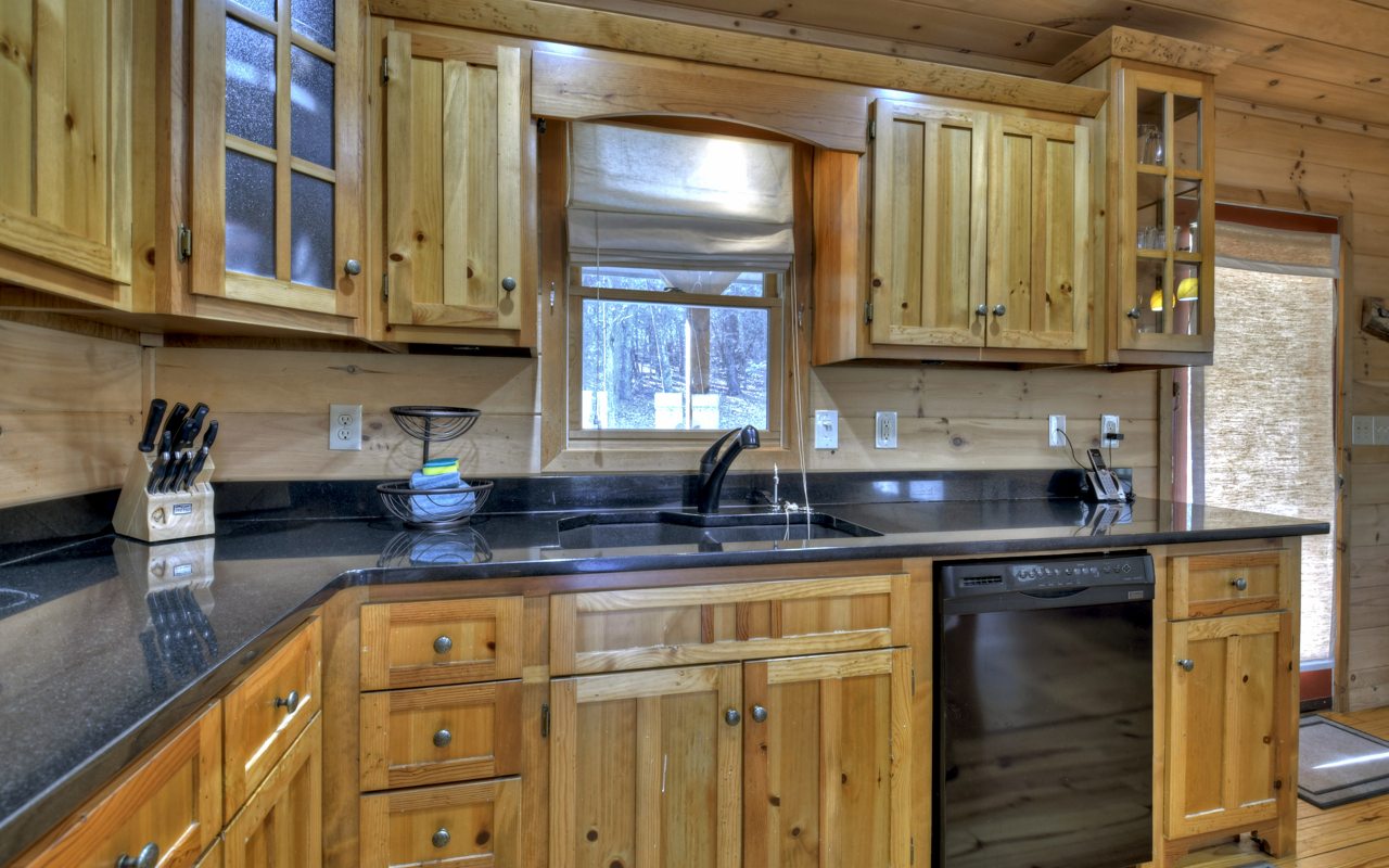 264 Sawmill Circle Blue Ridge, GA 30513 - Photo 17 of 39 a kitchen with stainless steel appliances granite countertop a sink stove and cabinets
