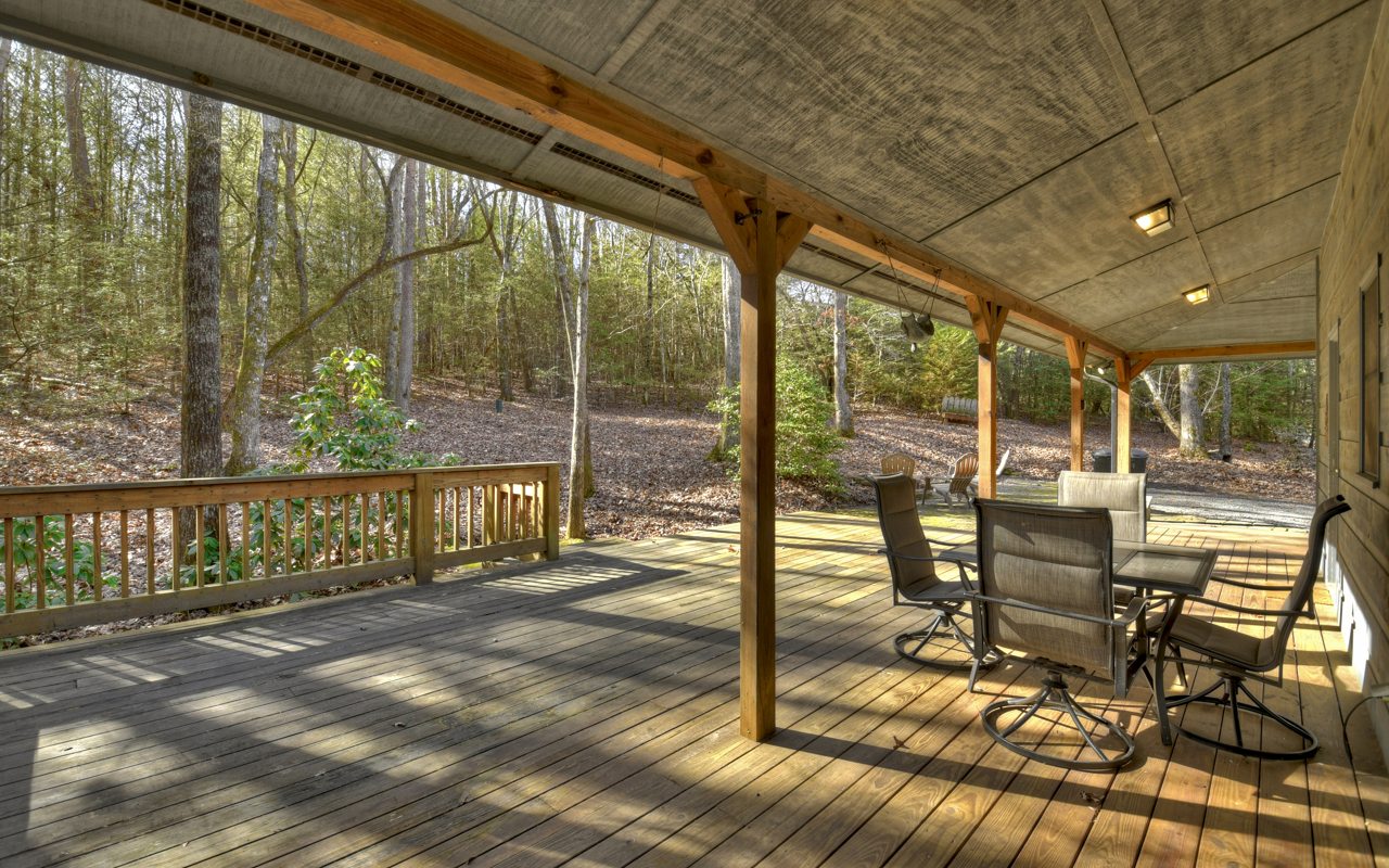 264 Sawmill Circle Blue Ridge, GA 30513 - Photo 34 of 39 a view of a porch with chairs and couches in the patio