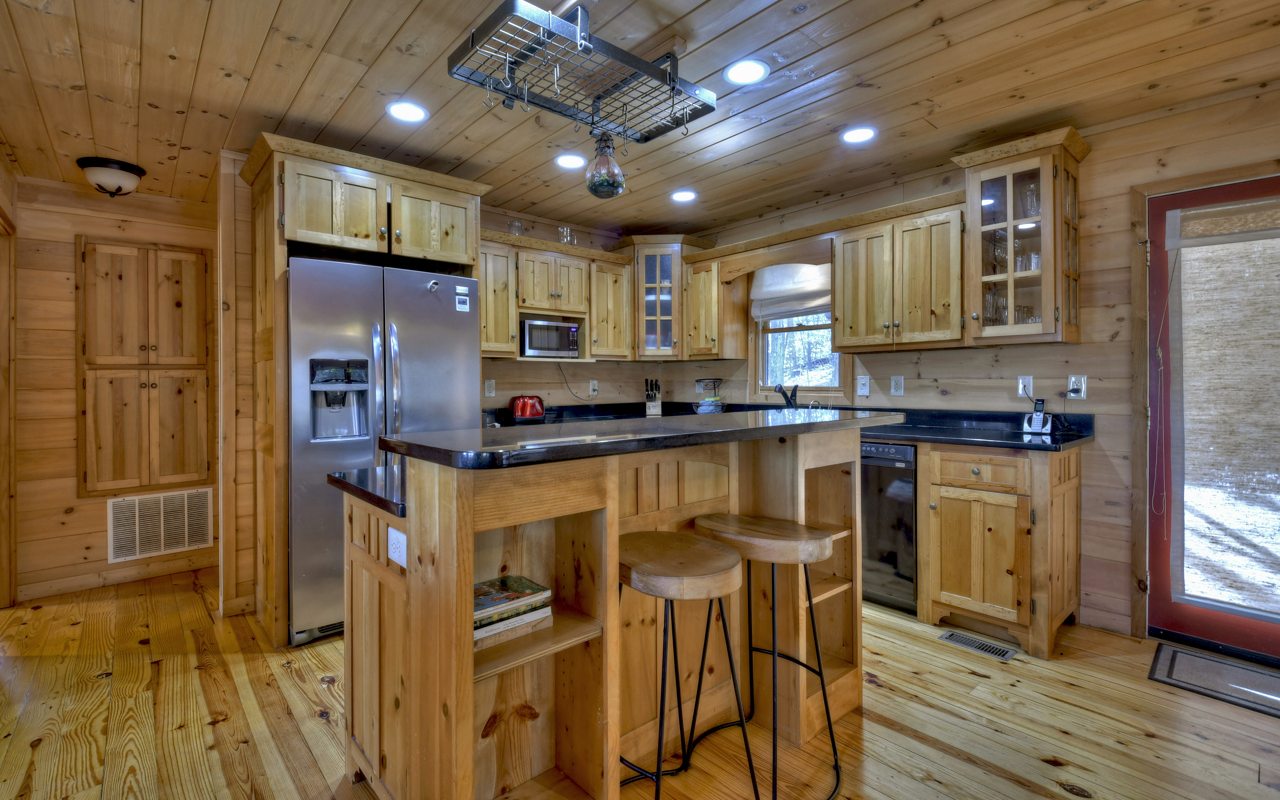 264 Sawmill Circle Blue Ridge, GA 30513 - Photo 4 of 39 a kitchen with stainless steel appliances granite countertop a refrigerator and a stove top oven