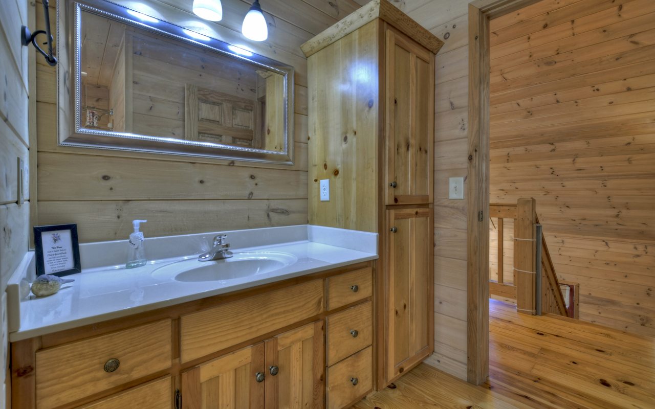 264 Sawmill Circle Blue Ridge, GA 30513 - Photo 8 of 39 a bathroom with a sink and a mirror