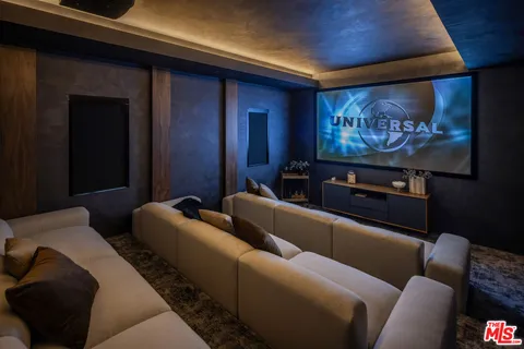 a media room with furniture and a flat screen tv
