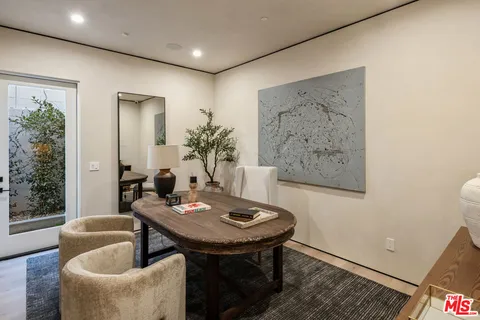 a view of a livingroom with furniture and window