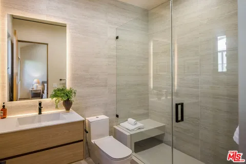 a bathroom with a bathtub sink and toilet
