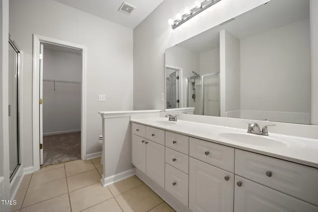 a kitchen with stainless steel appliances granite countertop a refrigerator sink and stove