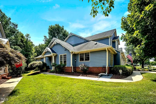 a view of an empty room with window and fire place