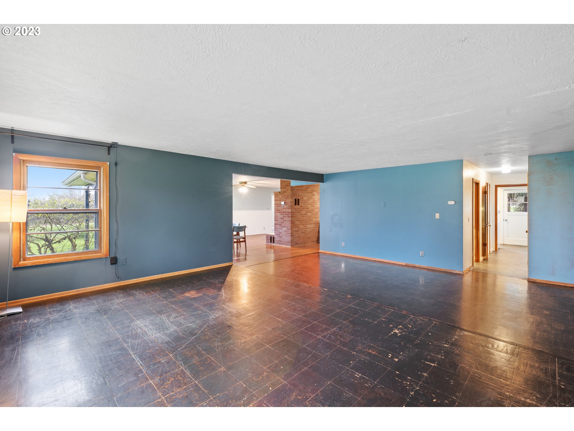 15200 Northwest Gillihan Road Portland, OR 97231 - Photo 12 of 42 a view of an empty room with window and wooden floor