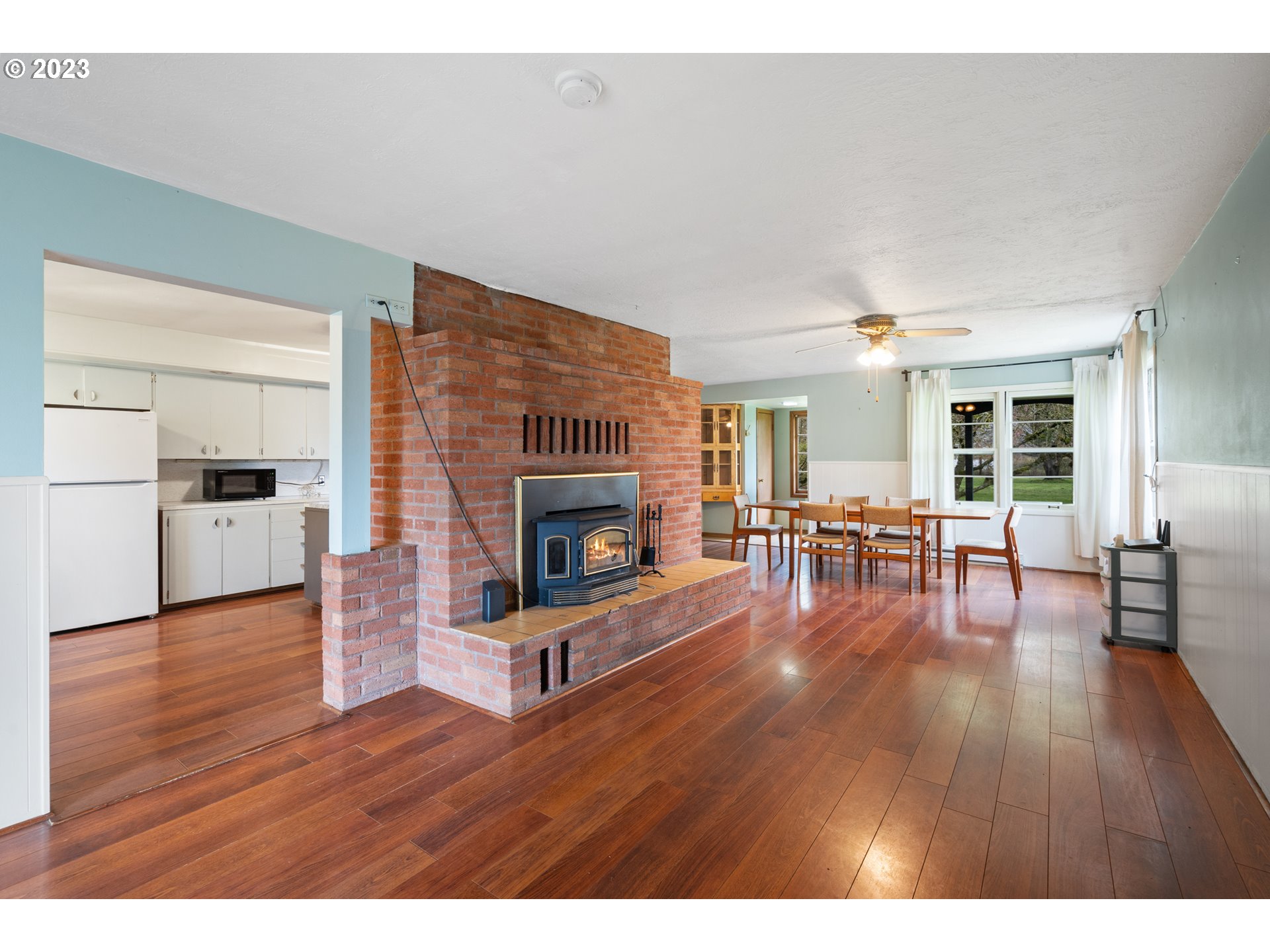 15200 Northwest Gillihan Road Portland, OR 97231 - Photo 7 of 42 a living room with furniture and a fireplace