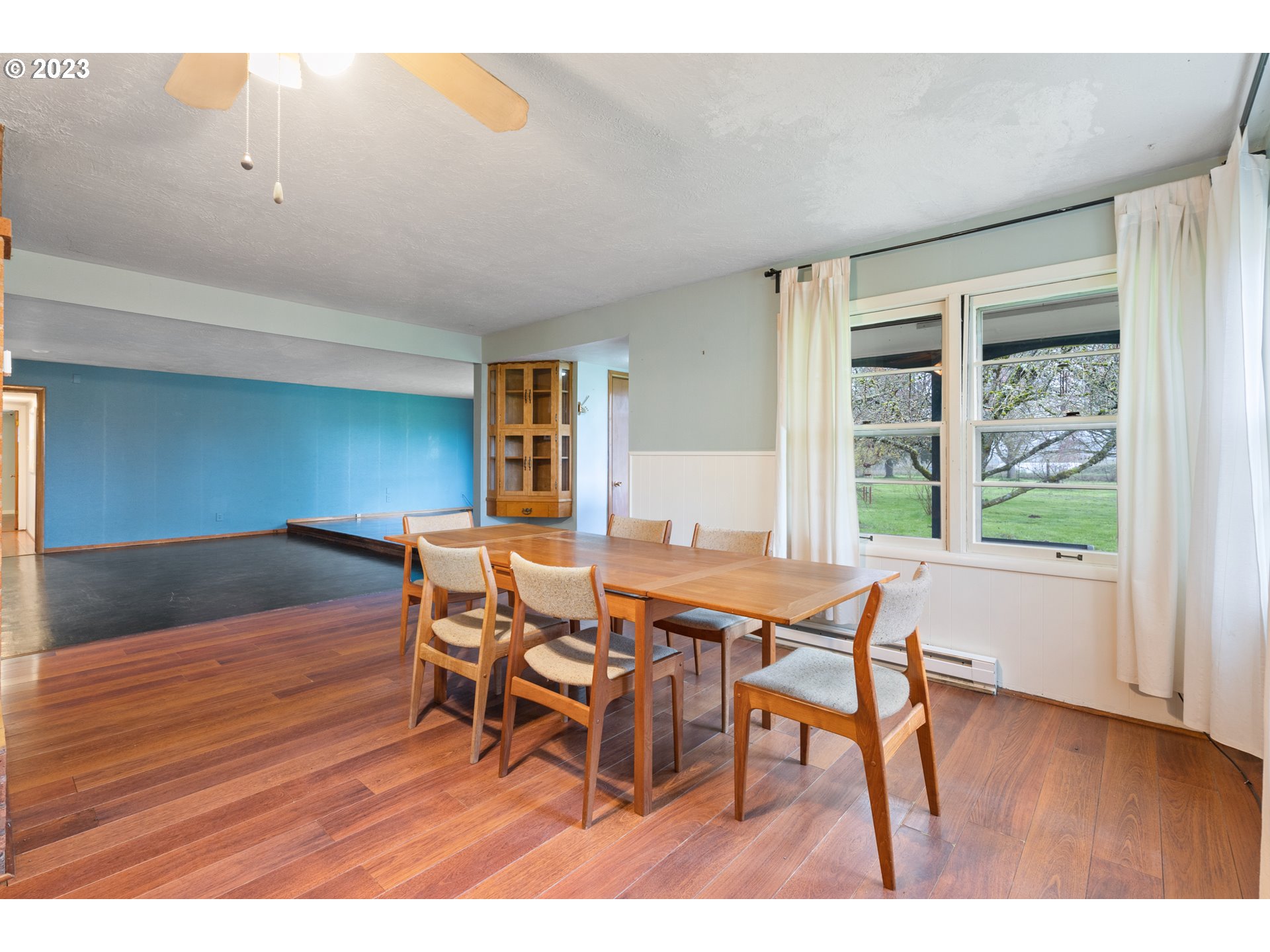 15200 Northwest Gillihan Road Portland, OR 97231 - Photo 10 of 42 a dining room with furniture and wooden floor