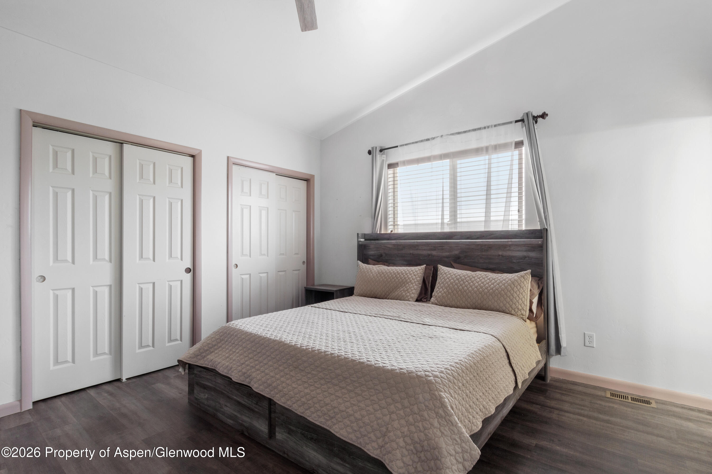 837 East 17th Street Rifle, CO 81650 - Photo 14 of 21 a bedroom with a bed and a window