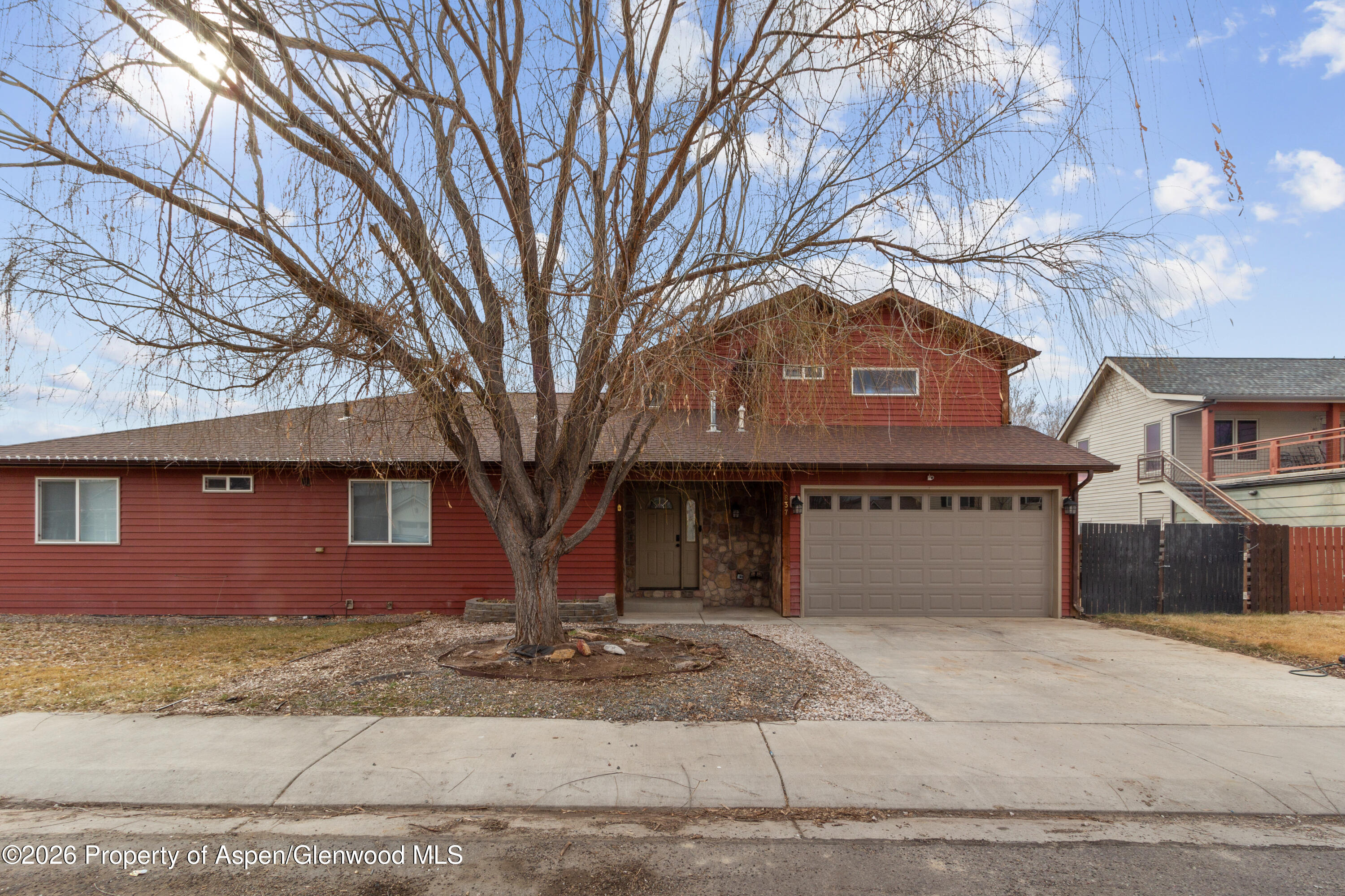 837 East 17th Street Rifle, CO 81650 - Photo 21 of 21 a front view of a house with a yard and garage