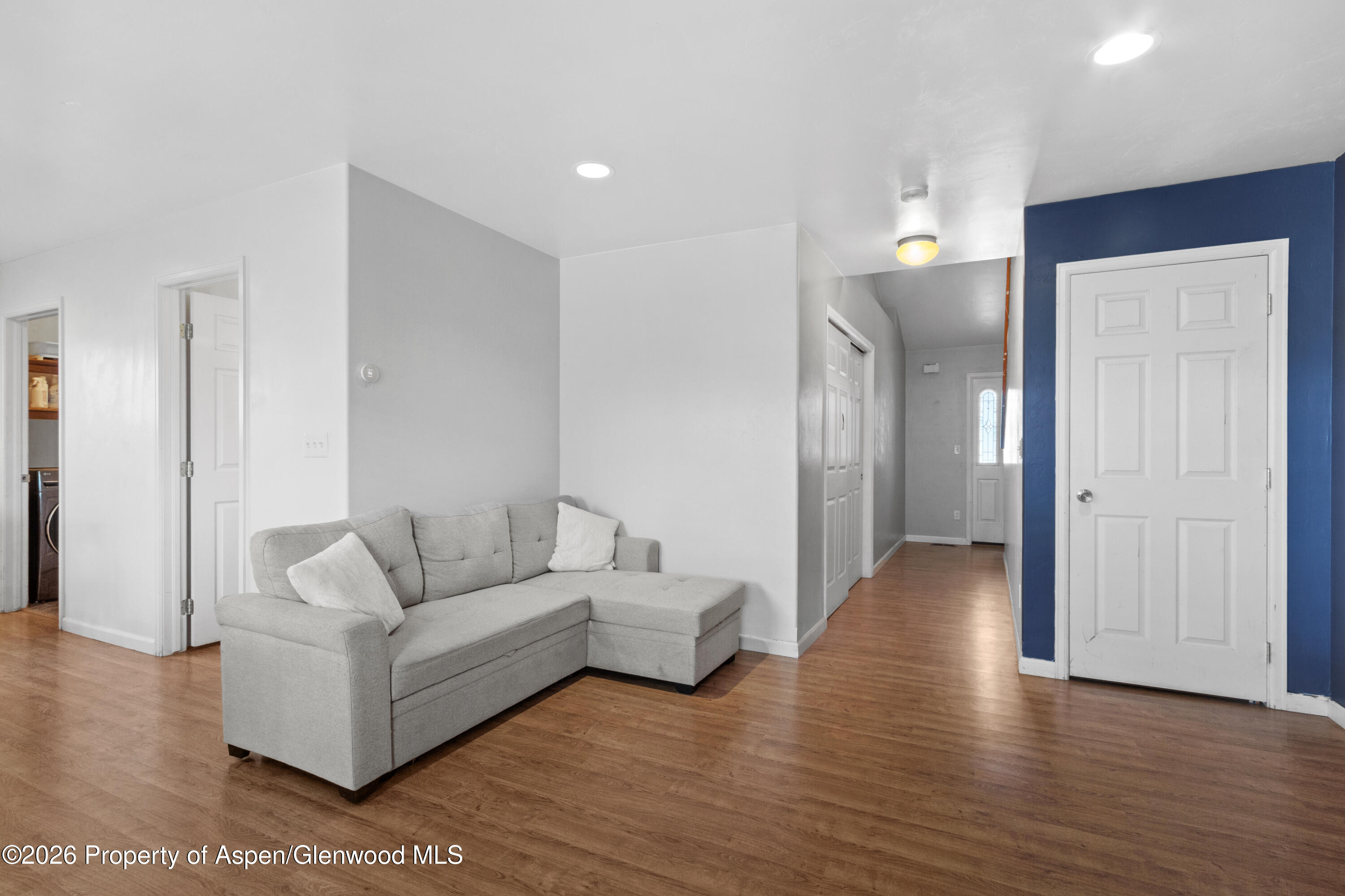 837 East 17th Street Rifle, CO 81650 - Photo 3 of 21 a living room with furniture and a wooden floor