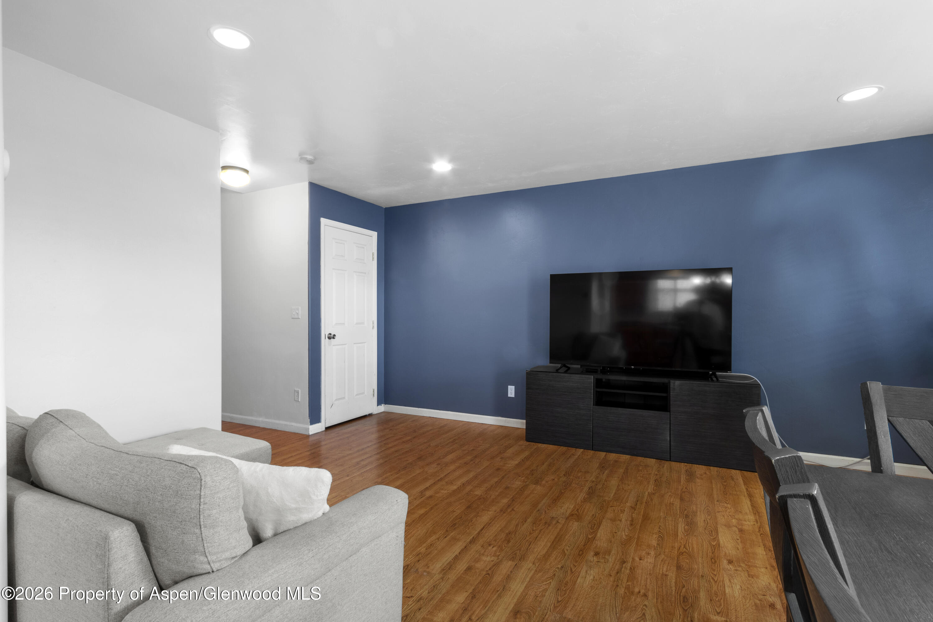 837 East 17th Street Rifle, CO 81650 - Photo 4 of 21 a living room with furniture and a flat screen tv