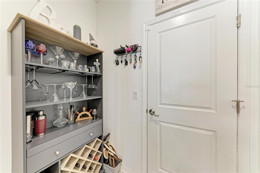 11637 Woodleaf Drive Lakewood Ranch, FL 34211 - Photo 17 of 54 a view of walk in closet with clothes and shoes