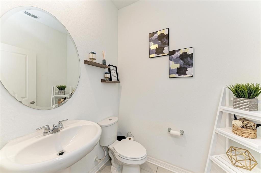11637 Woodleaf Drive Lakewood Ranch, FL 34211 - Photo 18 of 54 a bathroom with a sink mirror and toilet