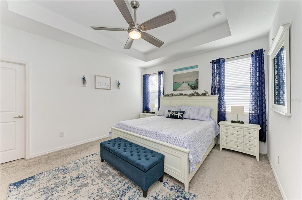 11637 Woodleaf Drive Lakewood Ranch, FL 34211 - Photo 20 of 54 a bedroom with a bed rug and window