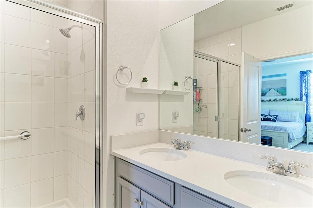 11637 Woodleaf Drive Lakewood Ranch, FL 34211 - Photo 23 of 54 a bathroom with a sink and a mirror