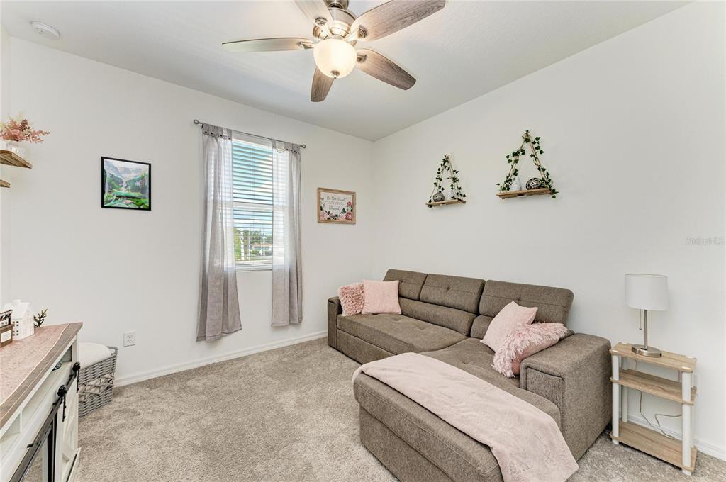 11637 Woodleaf Drive Lakewood Ranch, FL 34211 - Photo 26 of 54 a living room with furniture and a window
