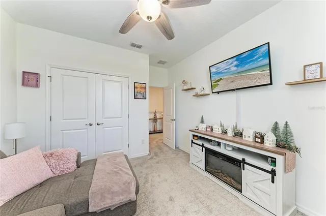 a bedroom with furniture and a chandelier