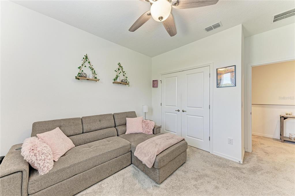 11637 Woodleaf Drive Lakewood Ranch, FL 34211 - Photo 28 of 54 a living room with furniture