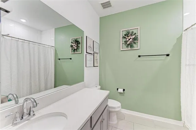 a bathroom with a sink and toilet