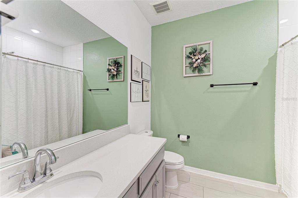 11637 Woodleaf Drive Lakewood Ranch, FL 34211 - Photo 29 of 54 a bathroom with a sink and toilet