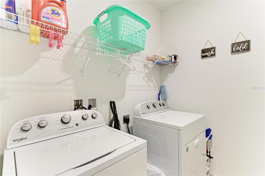 11637 Woodleaf Drive Lakewood Ranch, FL 34211 - Photo 32 of 54 a utility room with dryer and washer