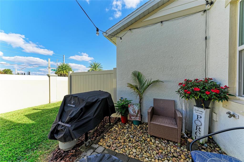 11637 Woodleaf Drive Lakewood Ranch, FL 34211 - Photo 35 of 54 a couple of potted plants in front of a door