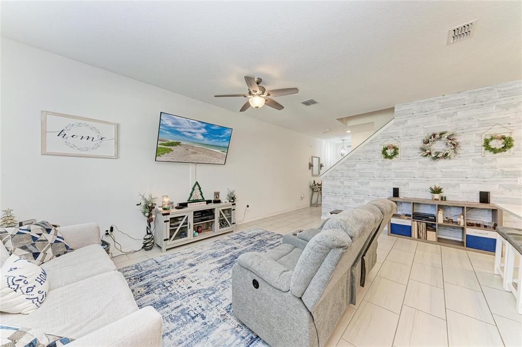 11637 Woodleaf Drive Lakewood Ranch, FL 34211 - Photo 6 of 54 a living room with furniture and a couch