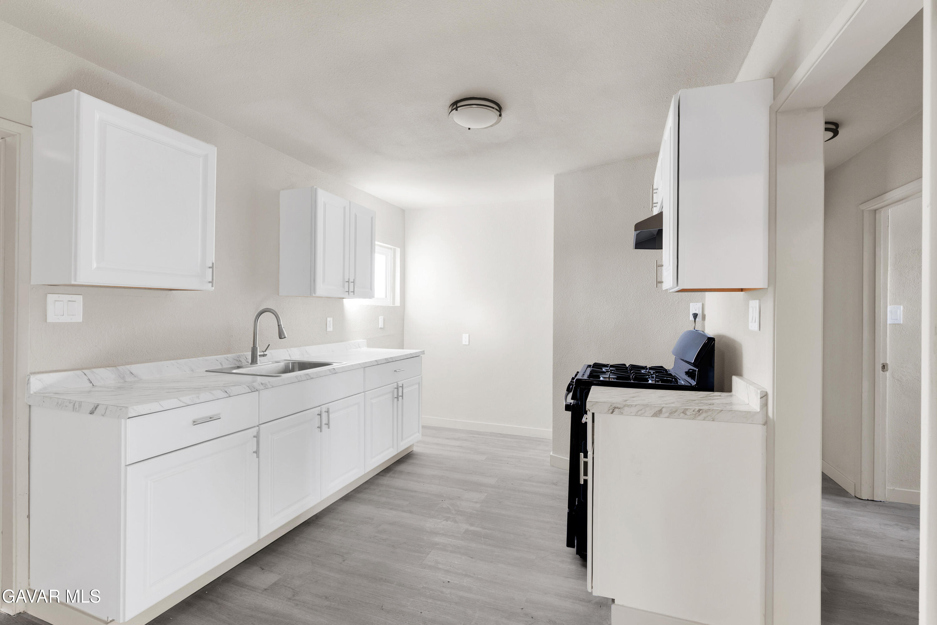 2494 Nadean Mojave, CA 93501 - Photo 4 of 19 a room with a sink a washer and dryer