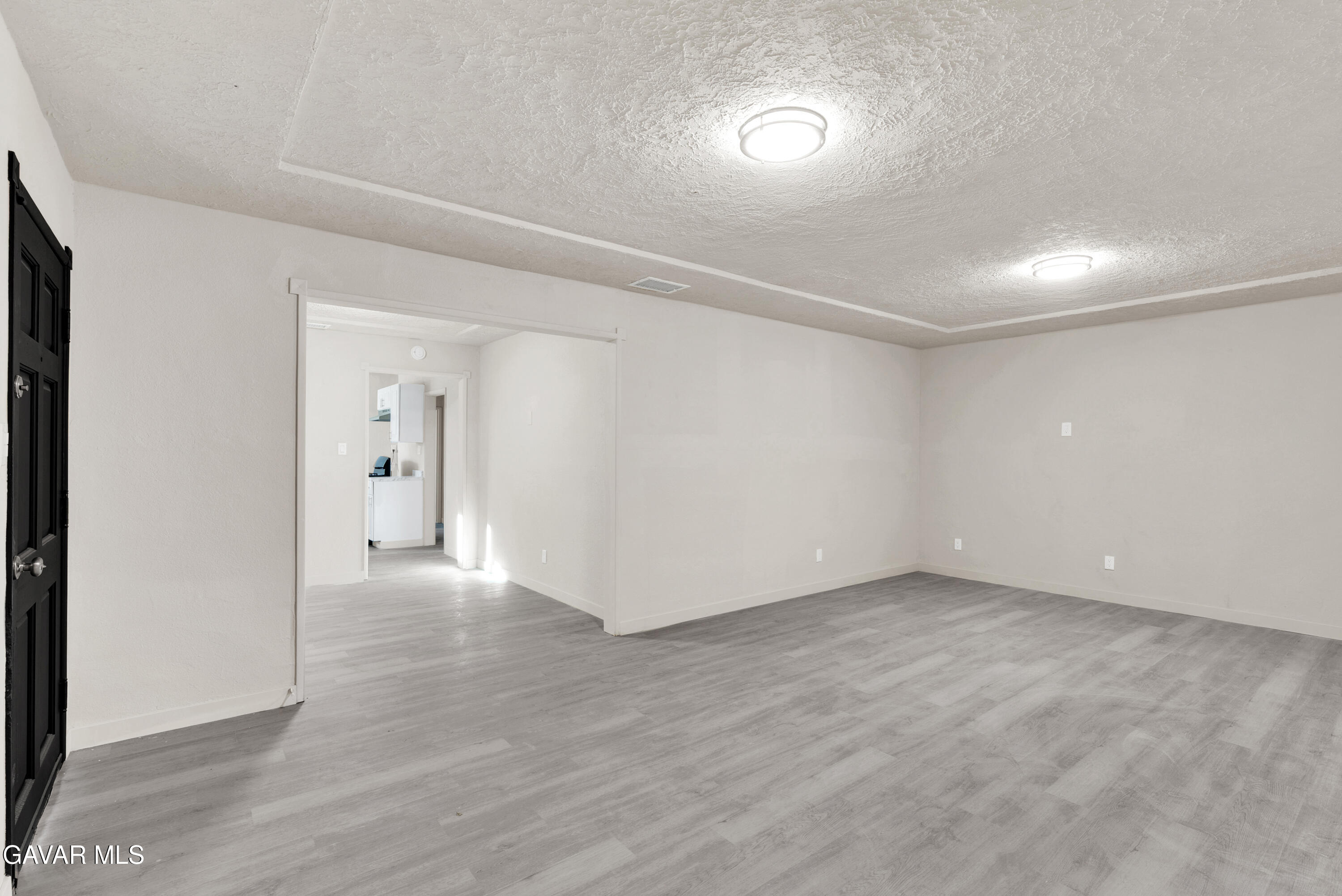2494 Nadean Mojave, CA 93501 - Photo 6 of 19 a view of an empty room and wooden floor