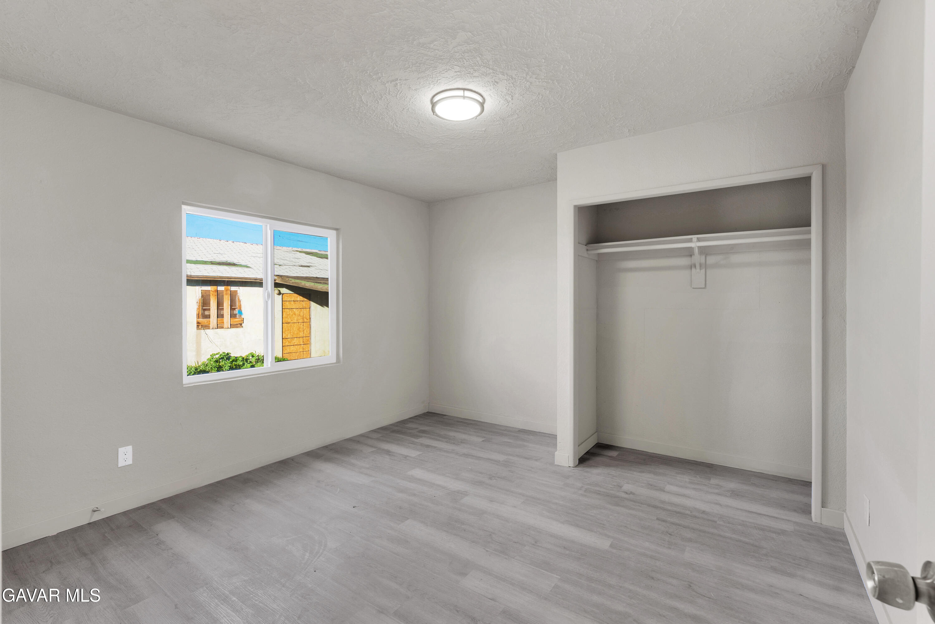 2494 Nadean Mojave, CA 93501 - Photo 10 of 19 an empty room with windows and closet