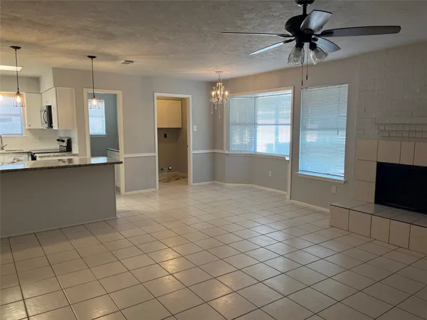 a view of a kitchen with furniture and a fireplace
