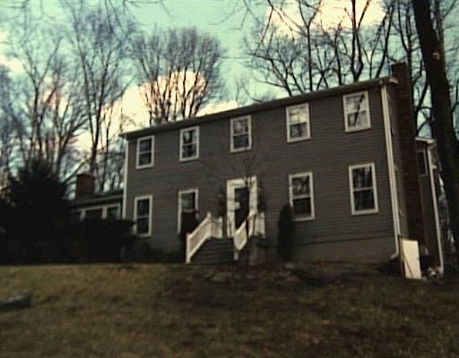 a outdoor view of a house with a yard